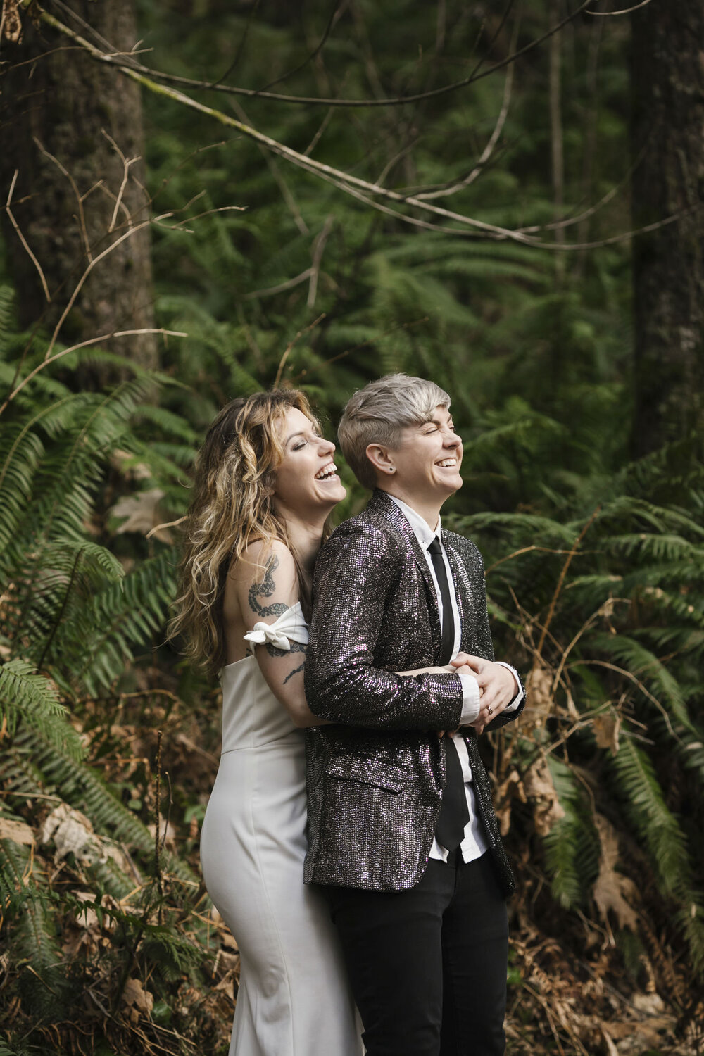 Wedding couple laugh with each other during their portraits on their elopement day
