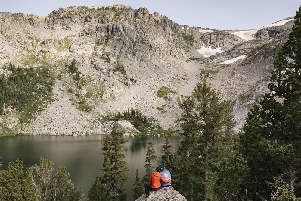 Adventure elopement couple take in the alpine lake view together