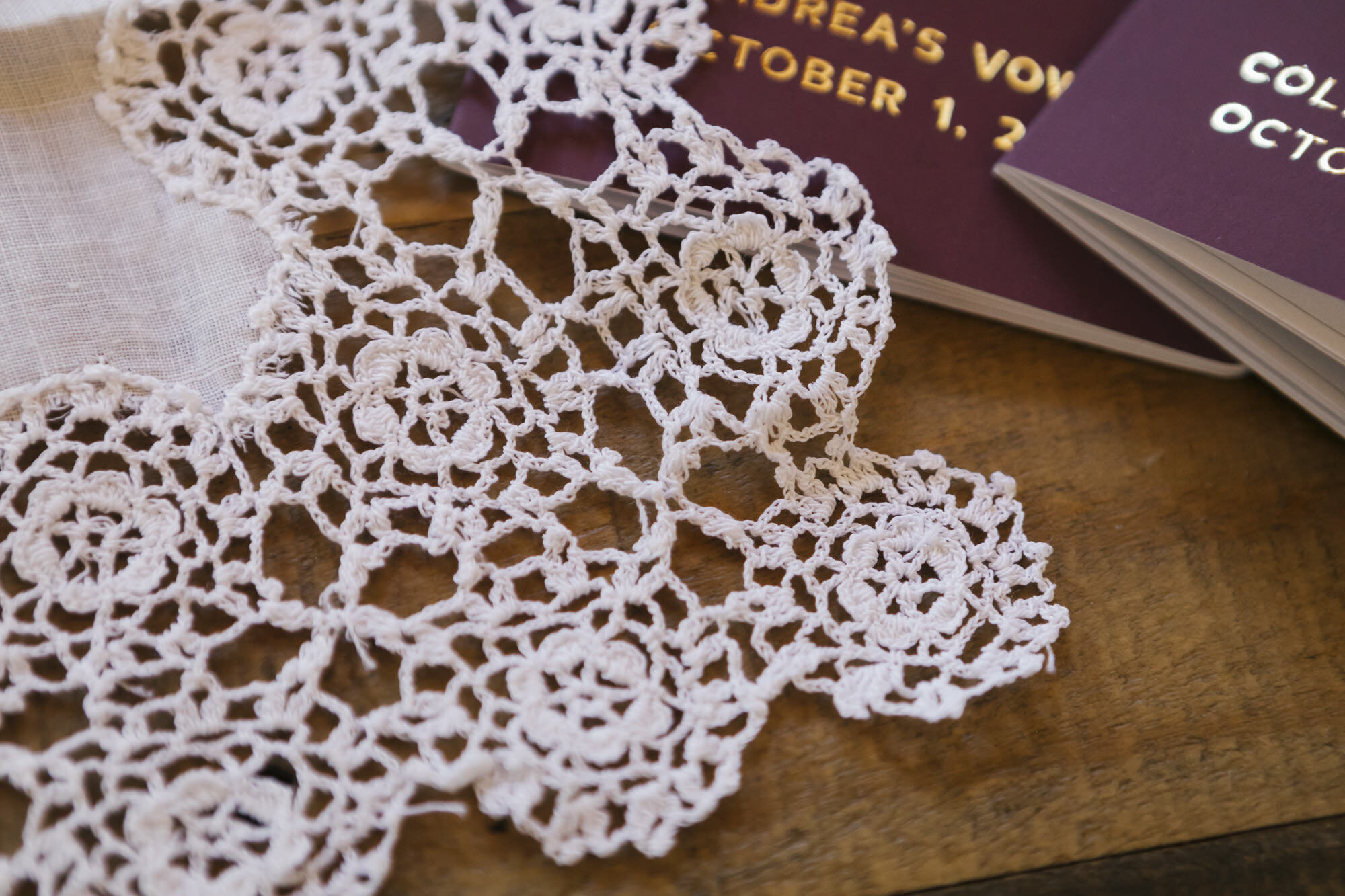 Close up of bride's grandmother's lace handkerchief during her adventurous elopement in the forest