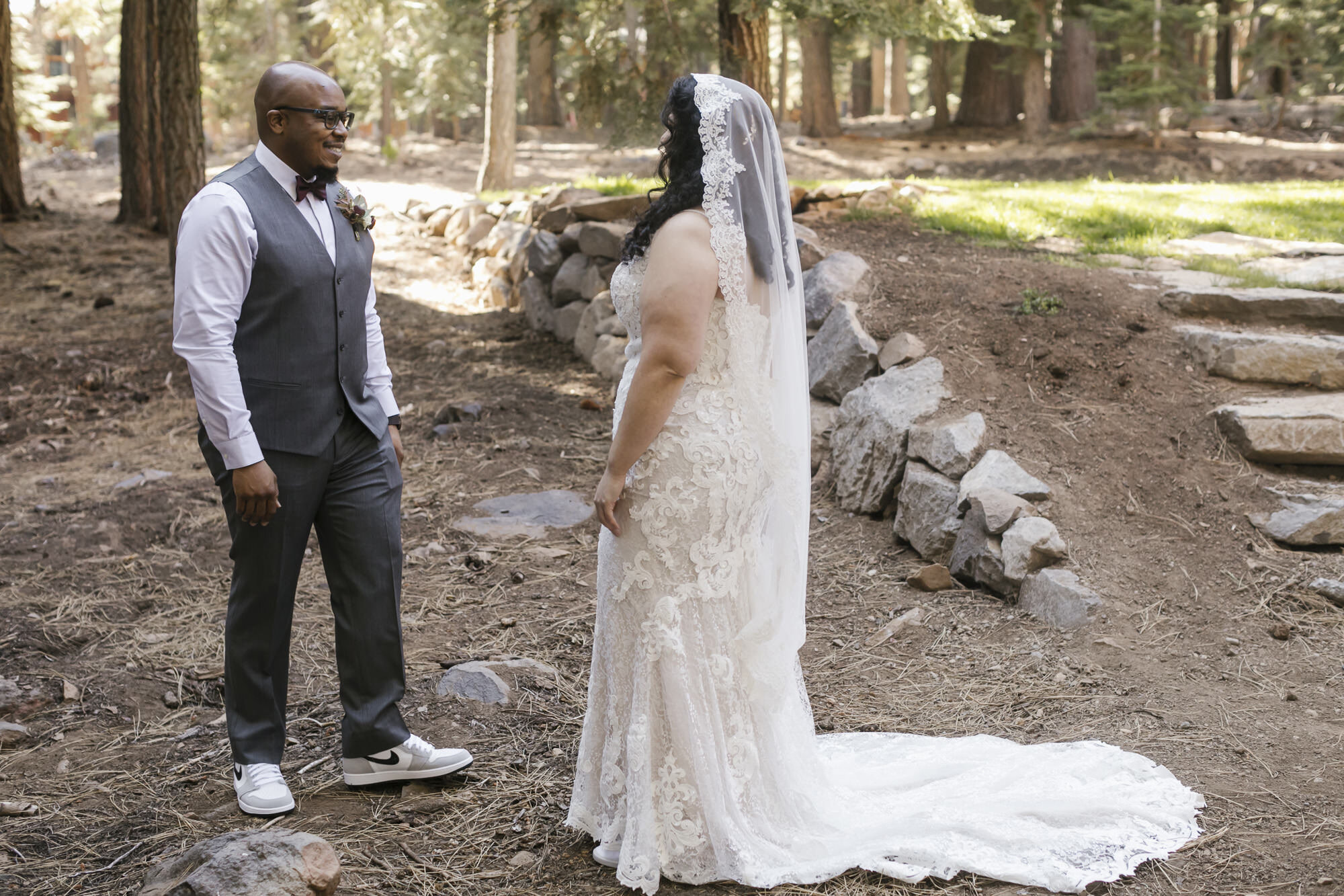 Groom sees his bride for the first time during their forest elopement in Tahoe California