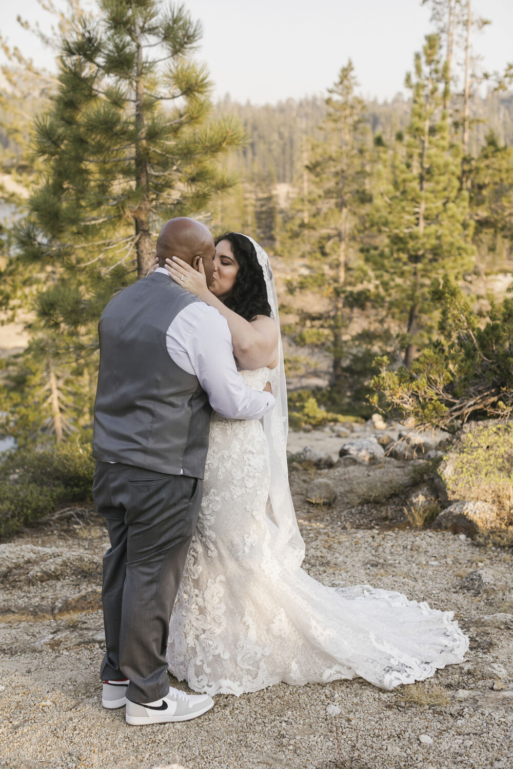 Wedding couple share their first kiss now that they're officially married!