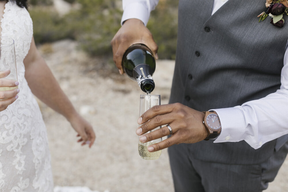 Groom pours champagne 