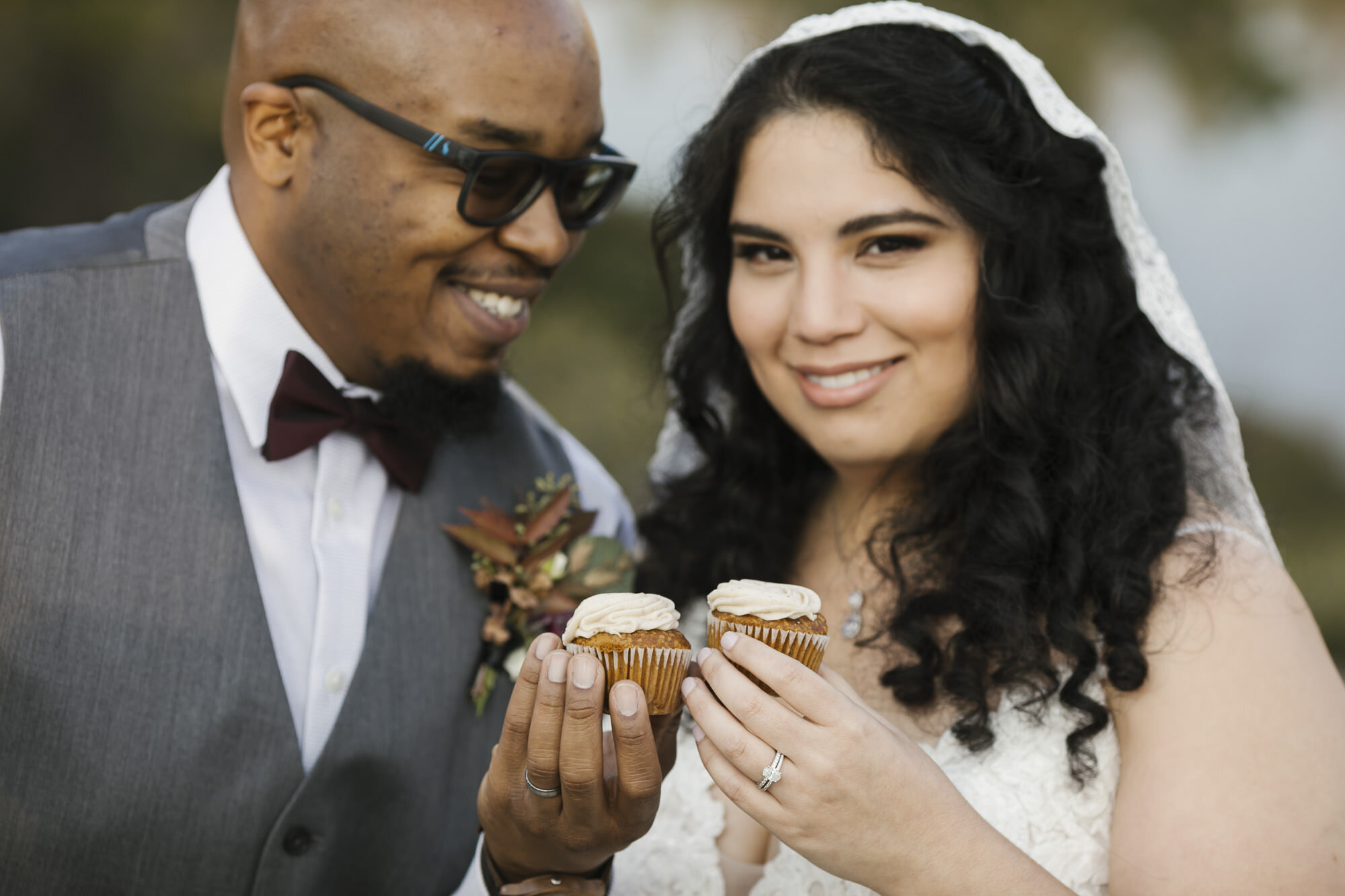 Bride and groom enjoy champagne and cupcakes after their wedding ceremony in the forest