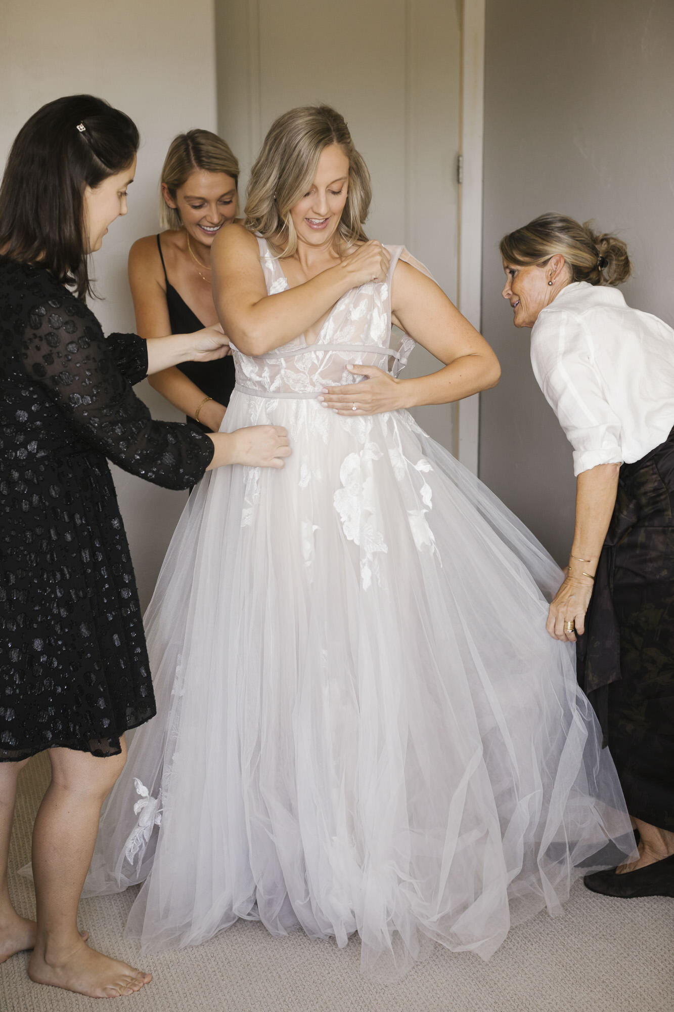 Utah bride getting into her BHLDN wedding dress