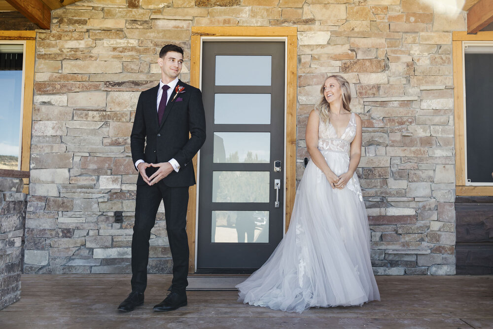 Utah wedding couple share their wedding first look outside their Airbnb near Zion
