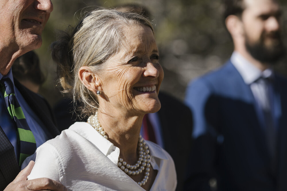 Mother of the bride smiles as her daughter gets married in the Utah desert