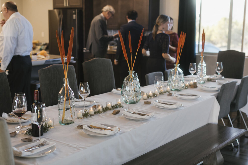 Wedding reception table set by the bride's mother with candles and dried flowers