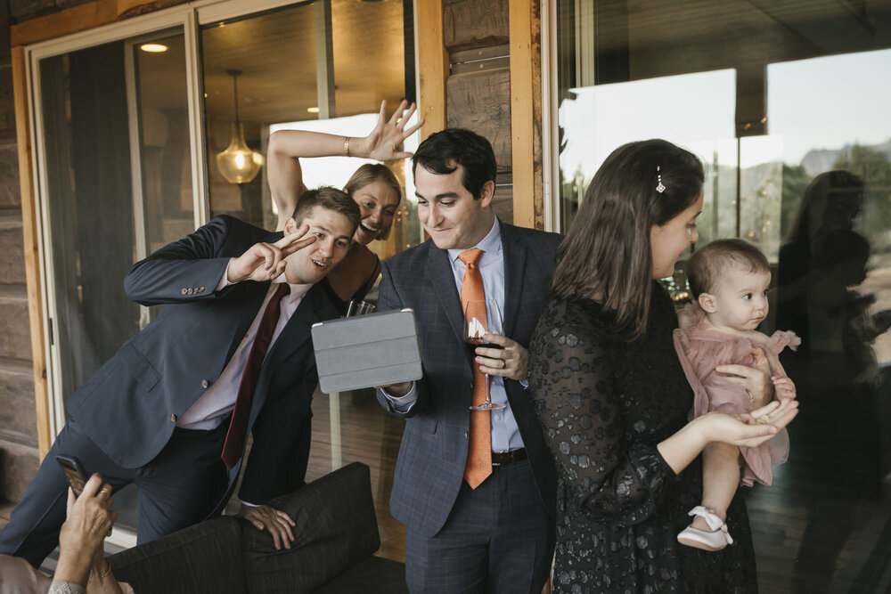 Family shares video chat during the bride and groom's first dance