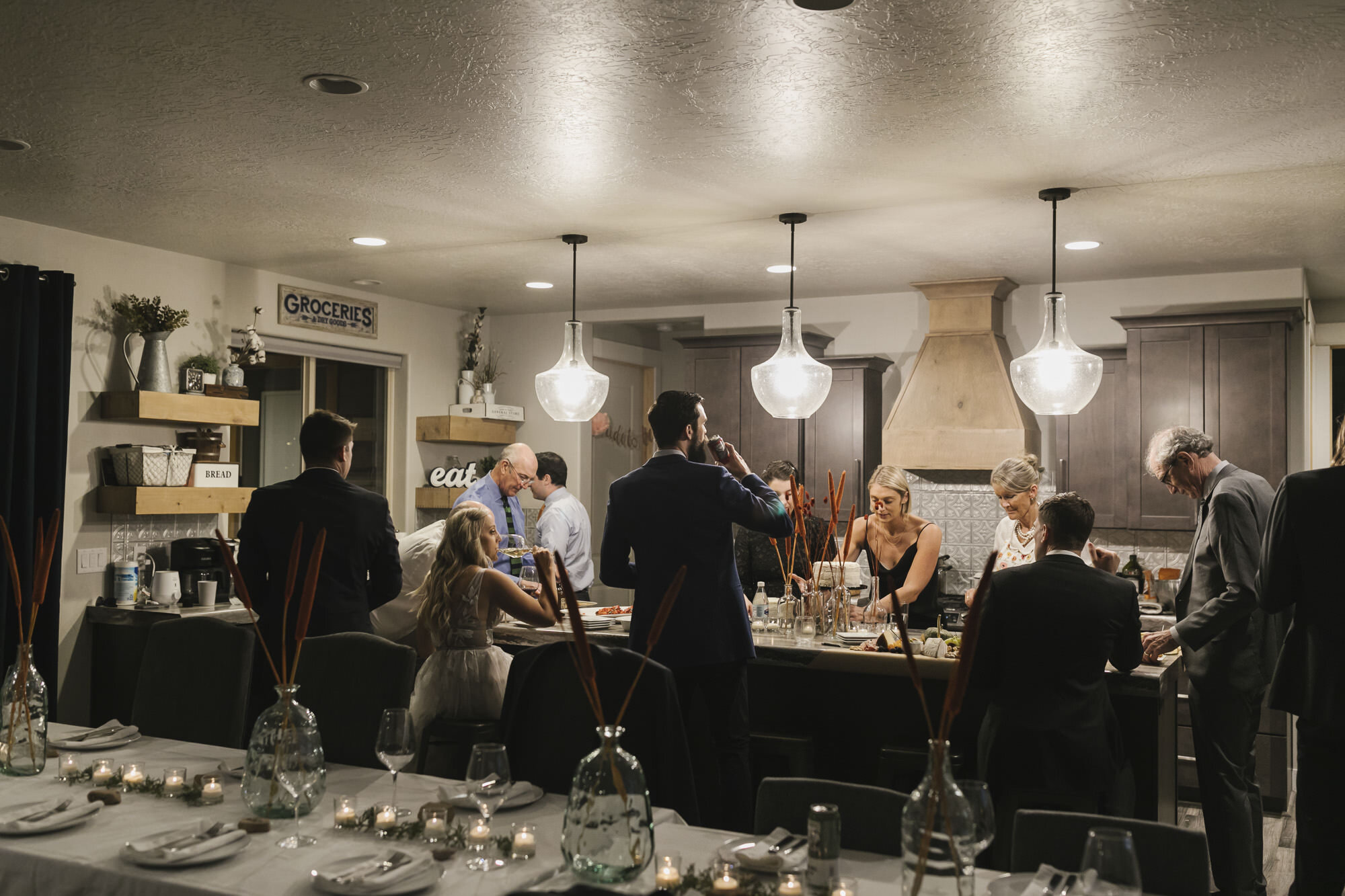 Bride and groom's families help make dinner in their Airbnb in the Utah desert