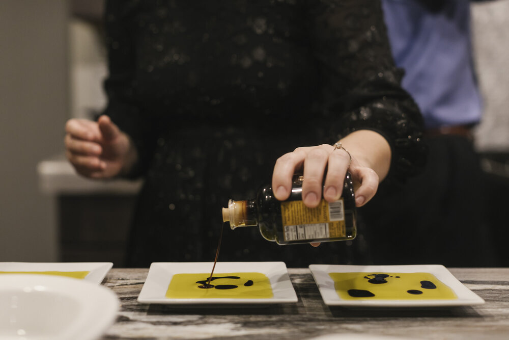 Bride's sister puts together oil and vinegar dishes for freshly baked bread