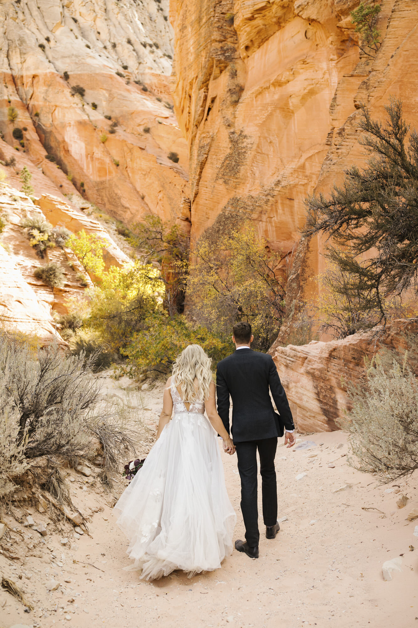Couple take their day-after wedding portraits in the Utah desert