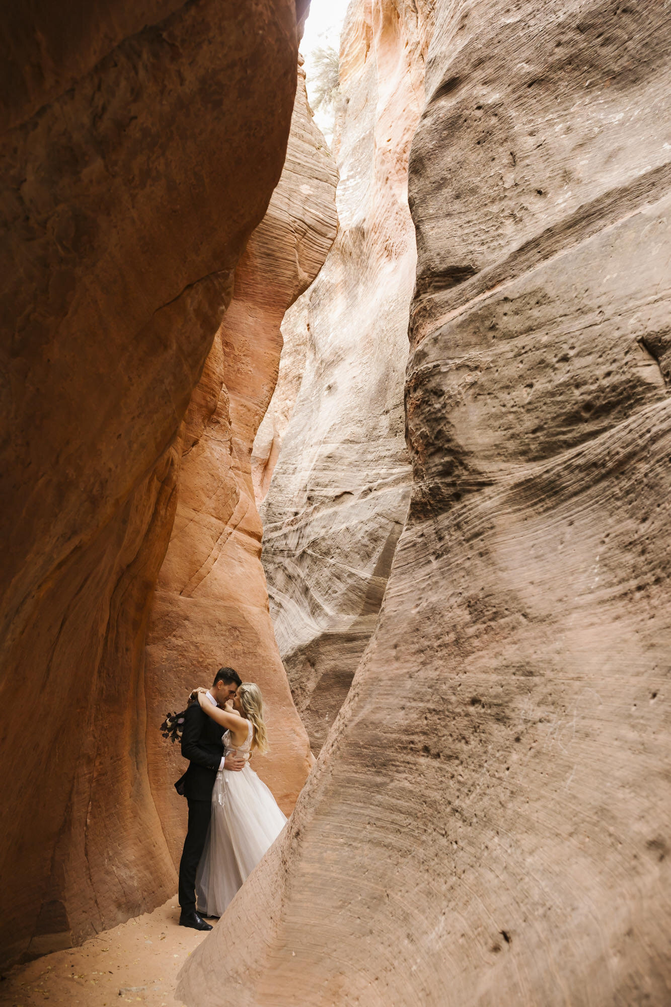 Couple take their wedding portraits in the Utah desert outside of Zion