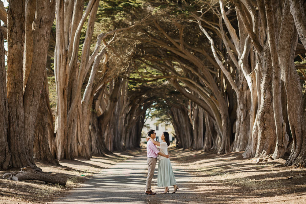 Point Reyes couple hold each other in the Cypress Tree Tunnel