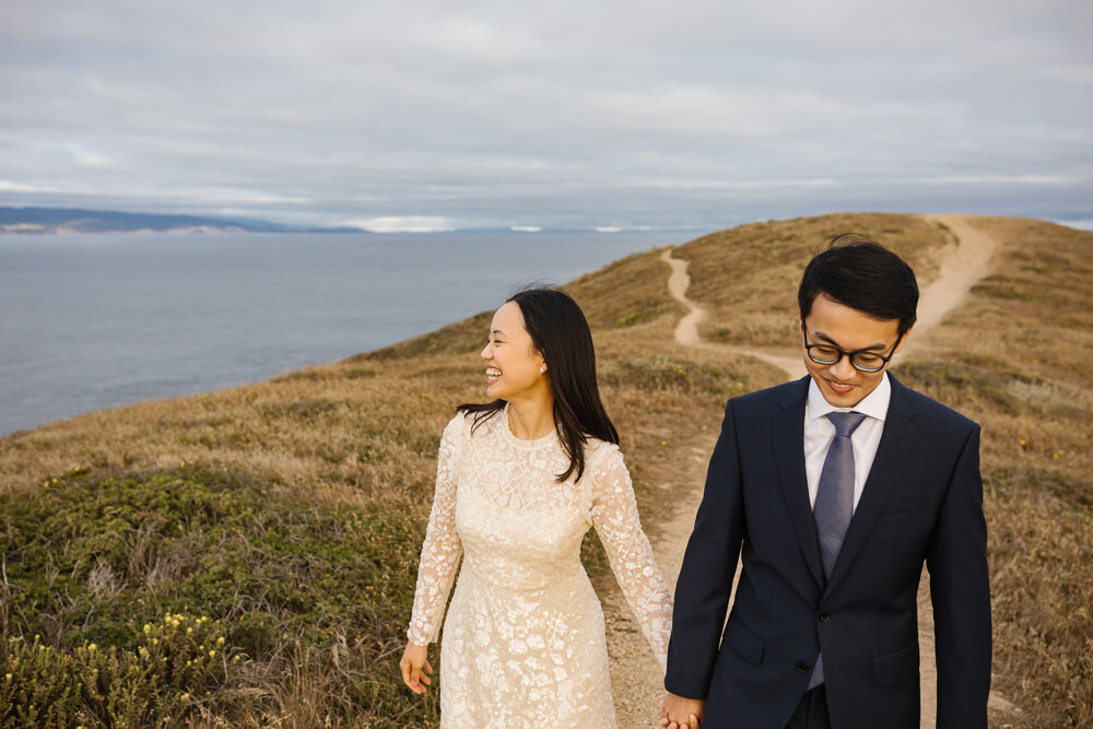 Elopement couple hold hands in Point Reyes