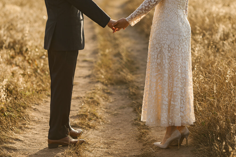 Elopement couple join hands in Point Reyes