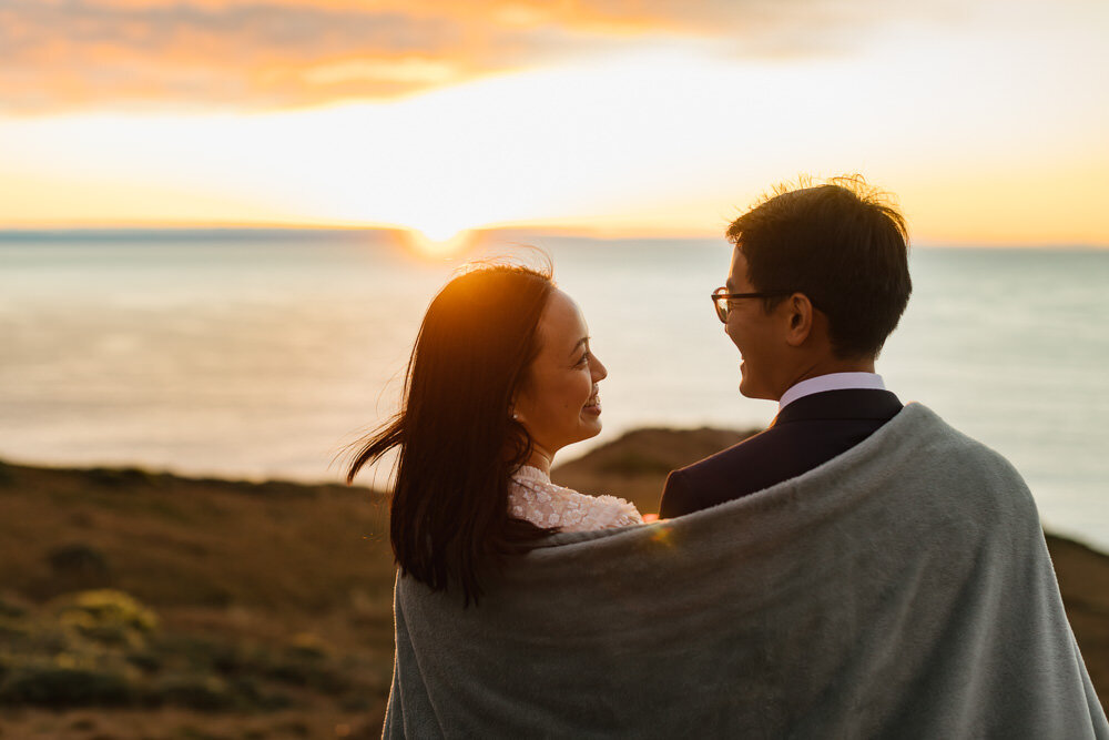 Wedding couple enjoy the sunset in Point Reyes