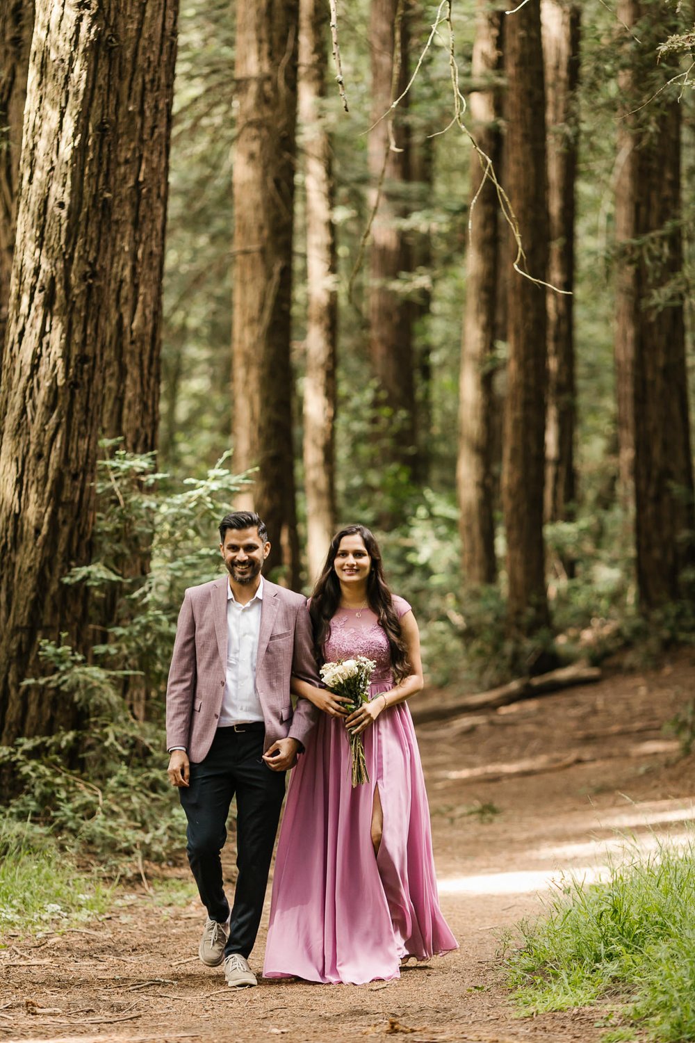 Bride enters ceremony at her redwood forest elopement