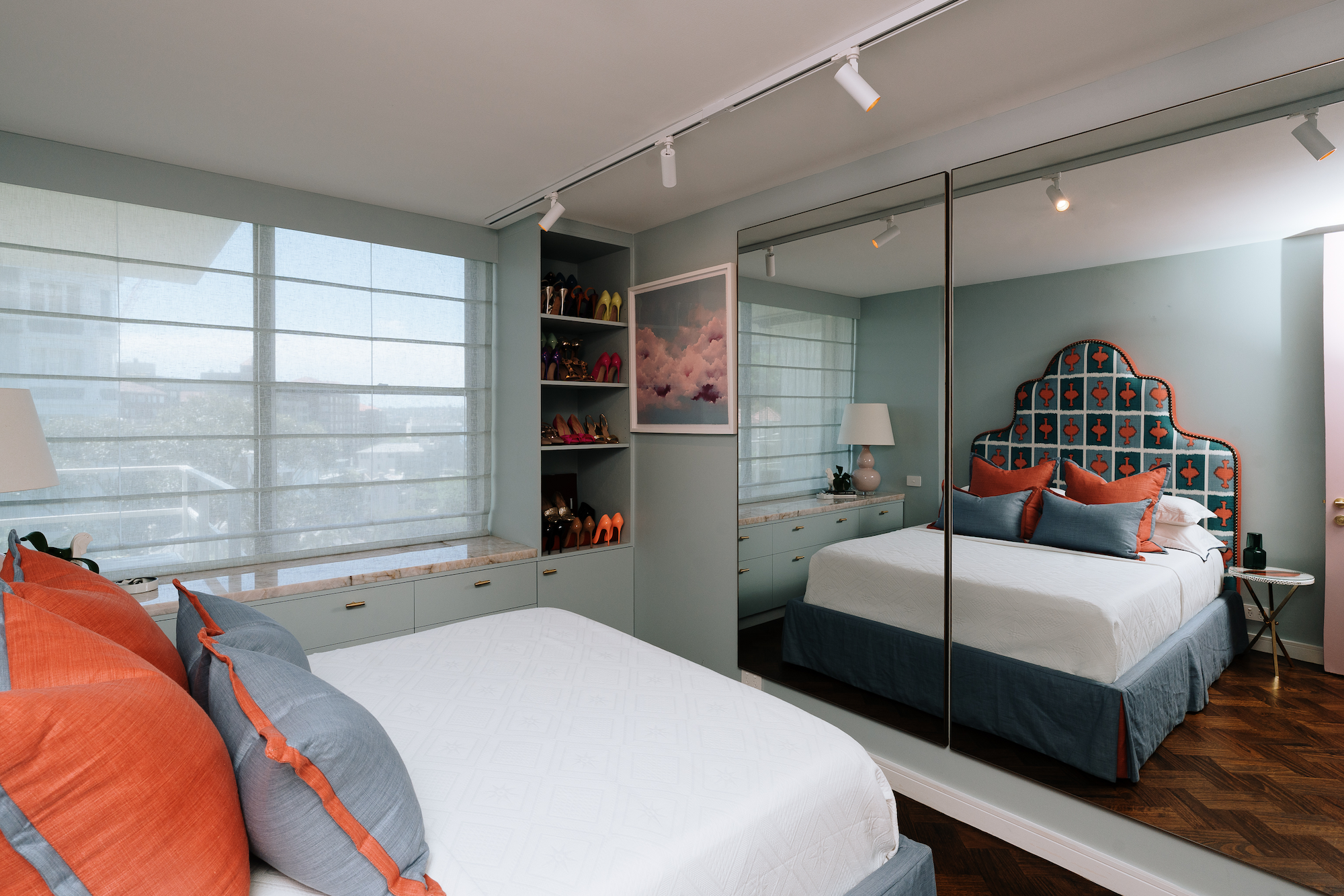 Custom bedroom at Onslow Residence featuring bespoke joinery, integrated storage, mirrored wardrobes, a statement upholstered headboard and luxury residential interior design in Sydney.
