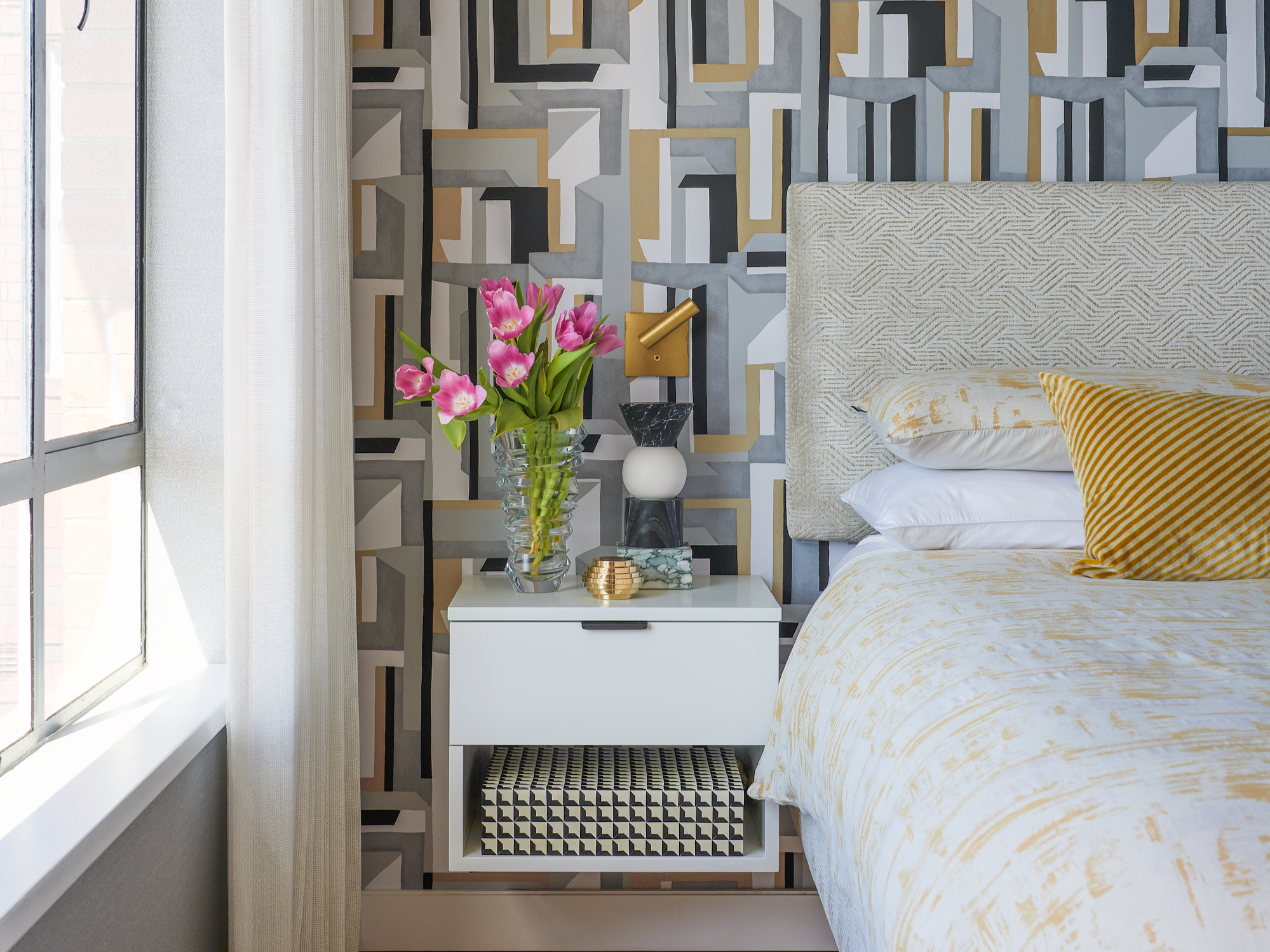 Luxury bedroom at Double Bay Residence showcasing a statement wallcovering, custom furnishings, fresh floral styling and bespoke interior detailing by Luis La Pegna Design.
