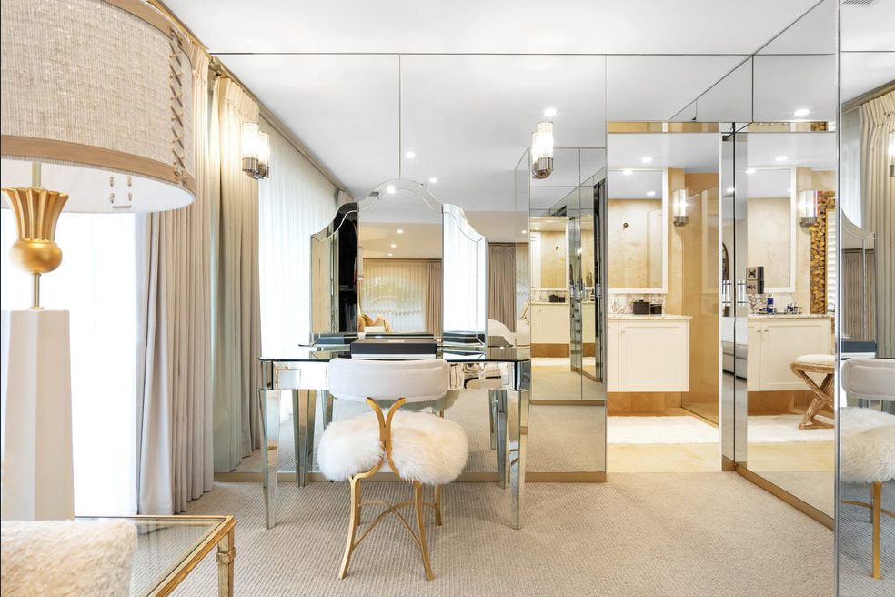 Luxury ensuite dressing room at Pearsons Residence featuring mirrored cabinetry, custom vanity, soft neutral furnishings and elegant hotel-inspired detailing by Luis La Pegna.