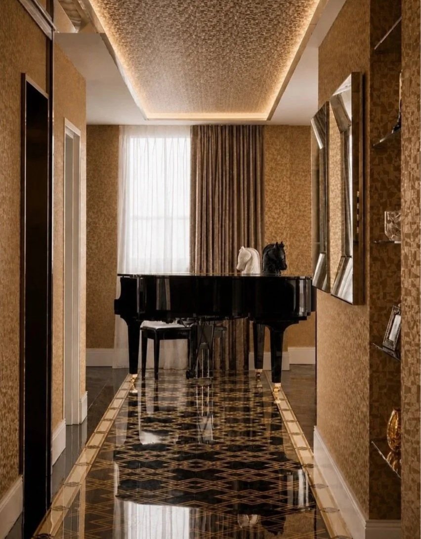 Inner West Penthouse entry foyer with a gold Casamance wallcovering and brass-inlaid parquet