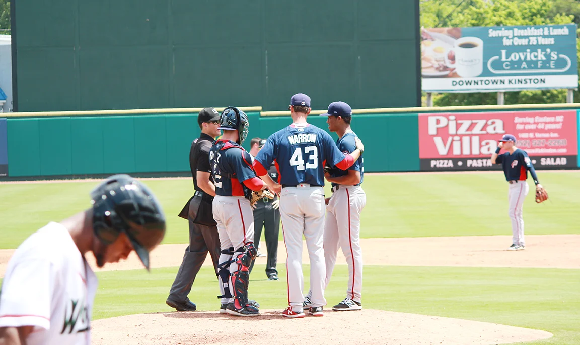 Potomac Nationals pitching coach Sam Narron meets with his pitchers on the mound during a game against the Down East Wood Ducks at Historic Grainger Stadium on Wednesday. Photo by Linda Whittington / Neuse News