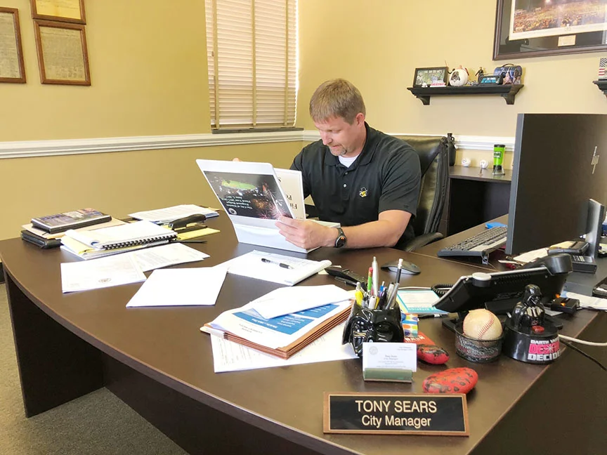 Kinston City Manager Tony Sears looks over the 2018-19 budget at City Hall last week. Photo by Bryan Hanks / Neuse News