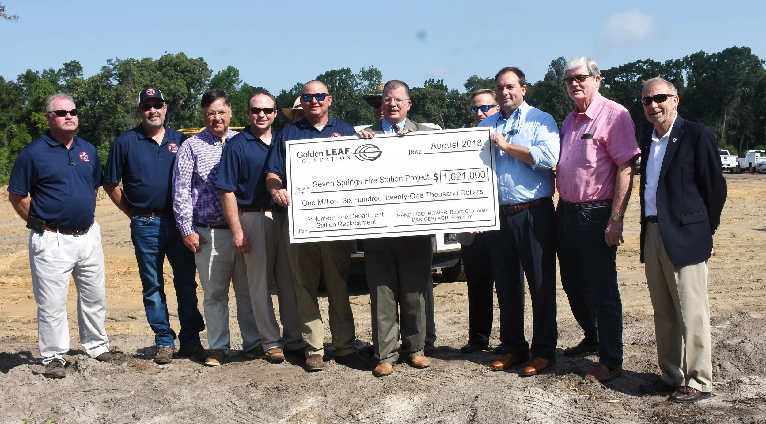 Officials hold the oversized check presented by Golden Leaf President Dan Gerlach. Photo by Linda Whittington / Neuse News