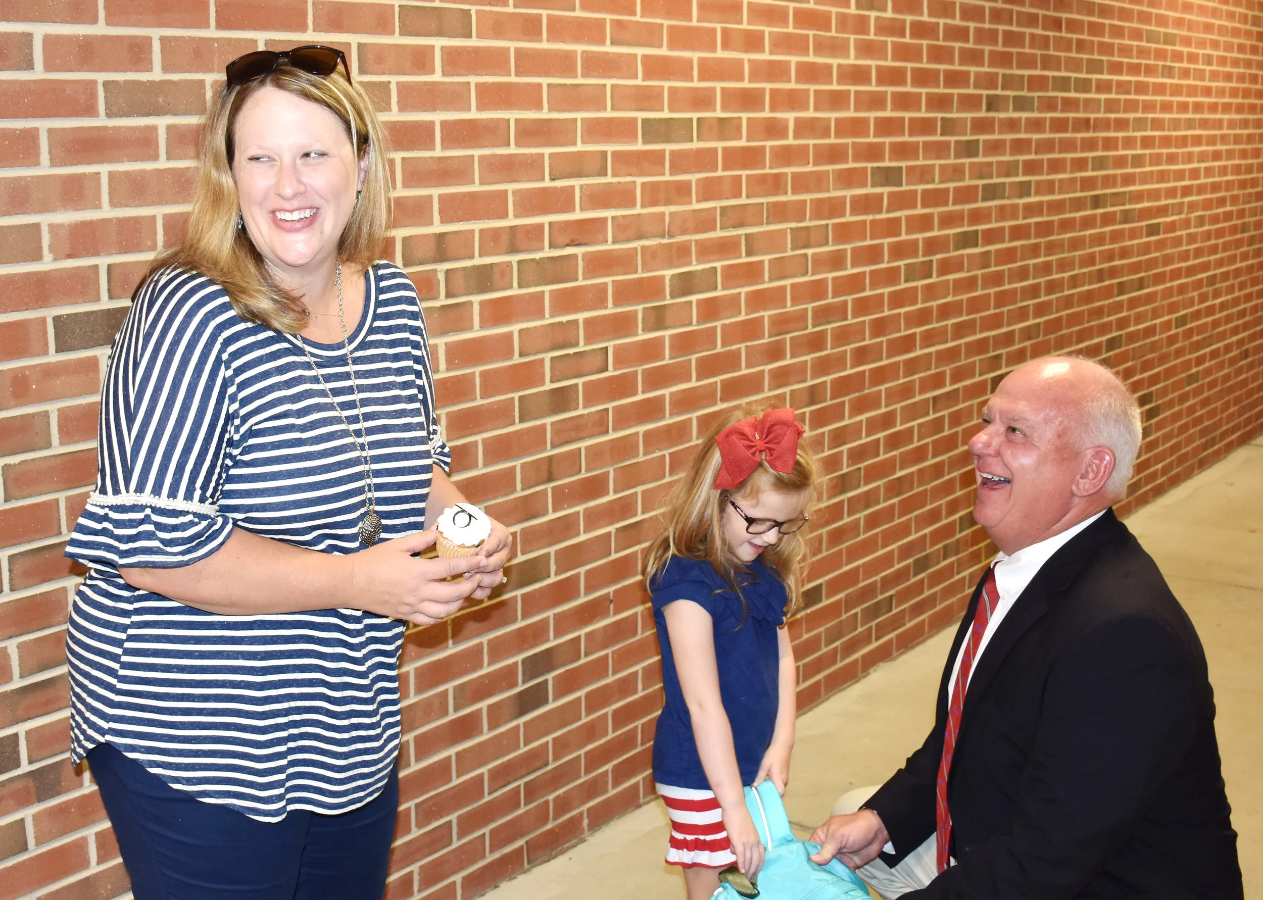 Natalie Sweeley, left, and Bright share a laugh with Sweeley’s daughter Anna Kate, a kindergarten student, on Monday. Photo by Bryan Hanks / Neuse News