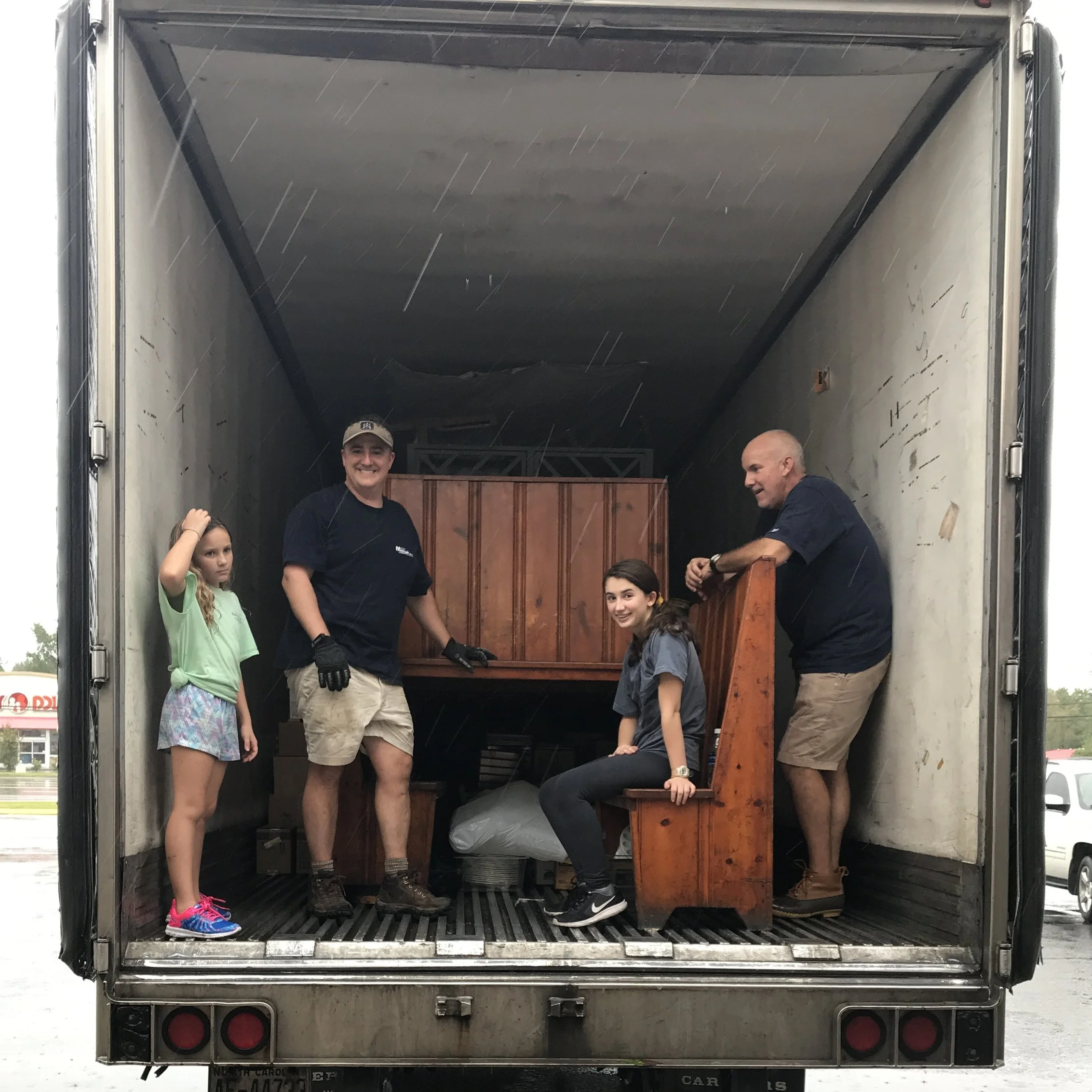 APA students help adults move furniture from King’s Restaurant before the Neuse River crested.