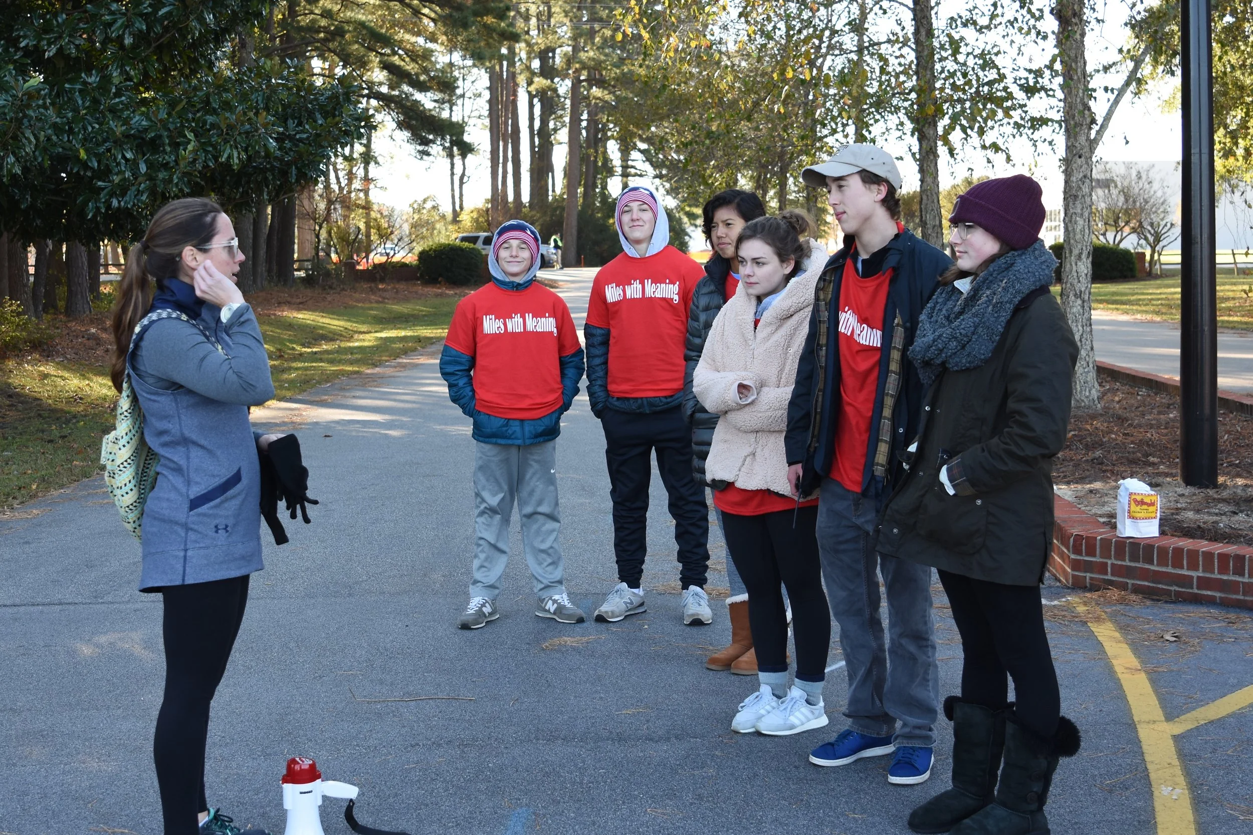 Photo caption: APA teacher and race coordinator Leslie Lewis deploys student volunteers, from left, Matt Wheelis, Morgan McPhaul, Erika Gorrin-Rivas, Sybil Sides, Jeff Bland, and Drew Dacey.