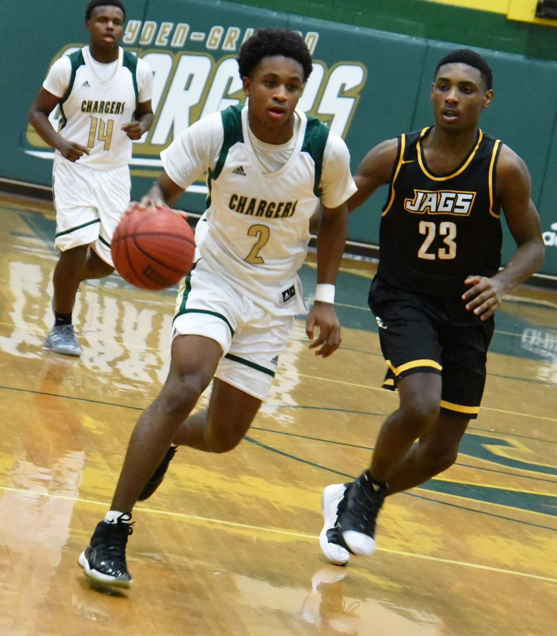 Ayden-Grifton’s James Richardson drives down the court while being pressured by Farmville Central’s Samage Teel in Tuesday’s contest. Photo by William “Bud” Hardy / Neuse News