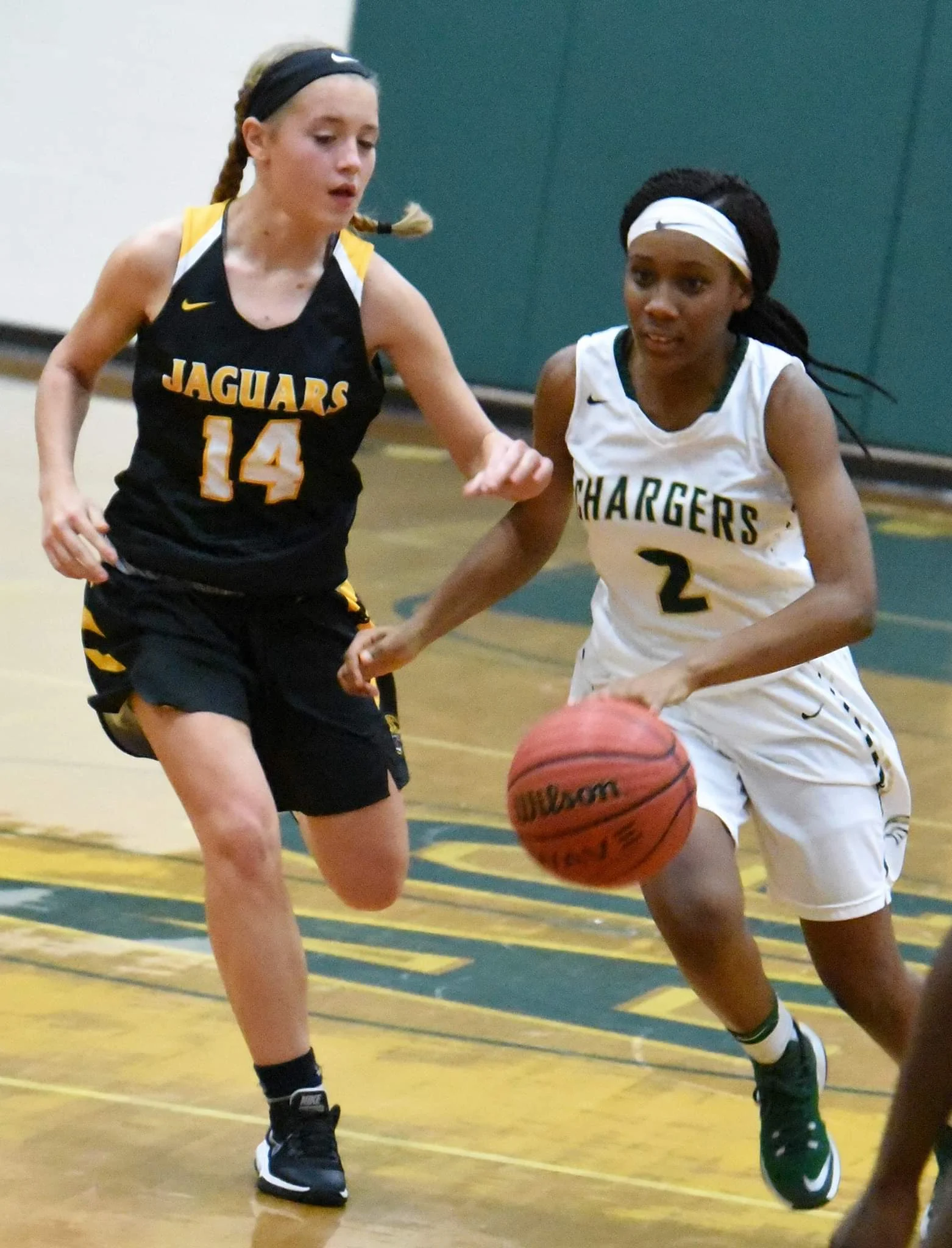 Ayden-Grifton’s Zy’kierah Andrews drives on Farmville Central’s Caren Dennam during Tuesday’s match. Photo by William “Bud” Hardy / Neuse News