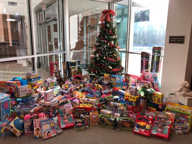 A picture of generosity: Parrott Academy’s Christmas tree towers over a flood of donated toys.