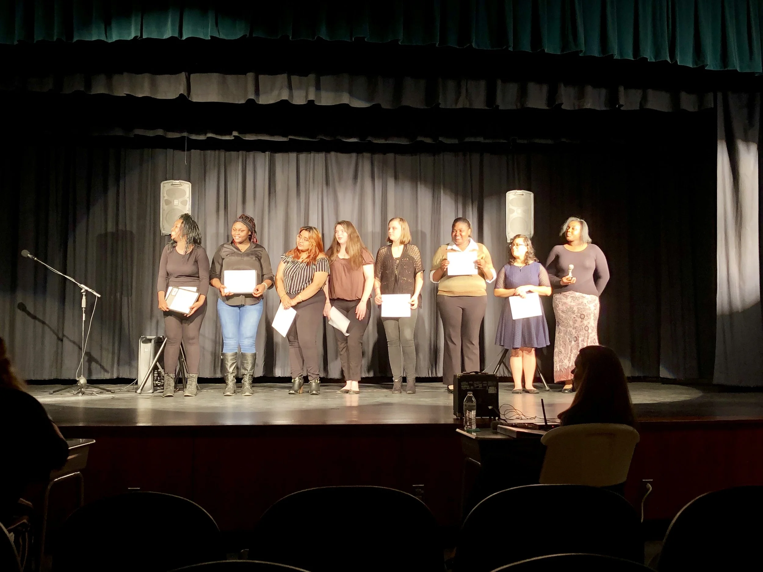 Poetry Out Loud competitors: L-R, Aaliyah Moore, Samantha Newton, Wendy Luviano, Hailey Braxton, Ashley Hood, Evelyn Allen, Anahi Zapata, Nyashia Sutton. Photo by Catherine Hardee / Neuse News