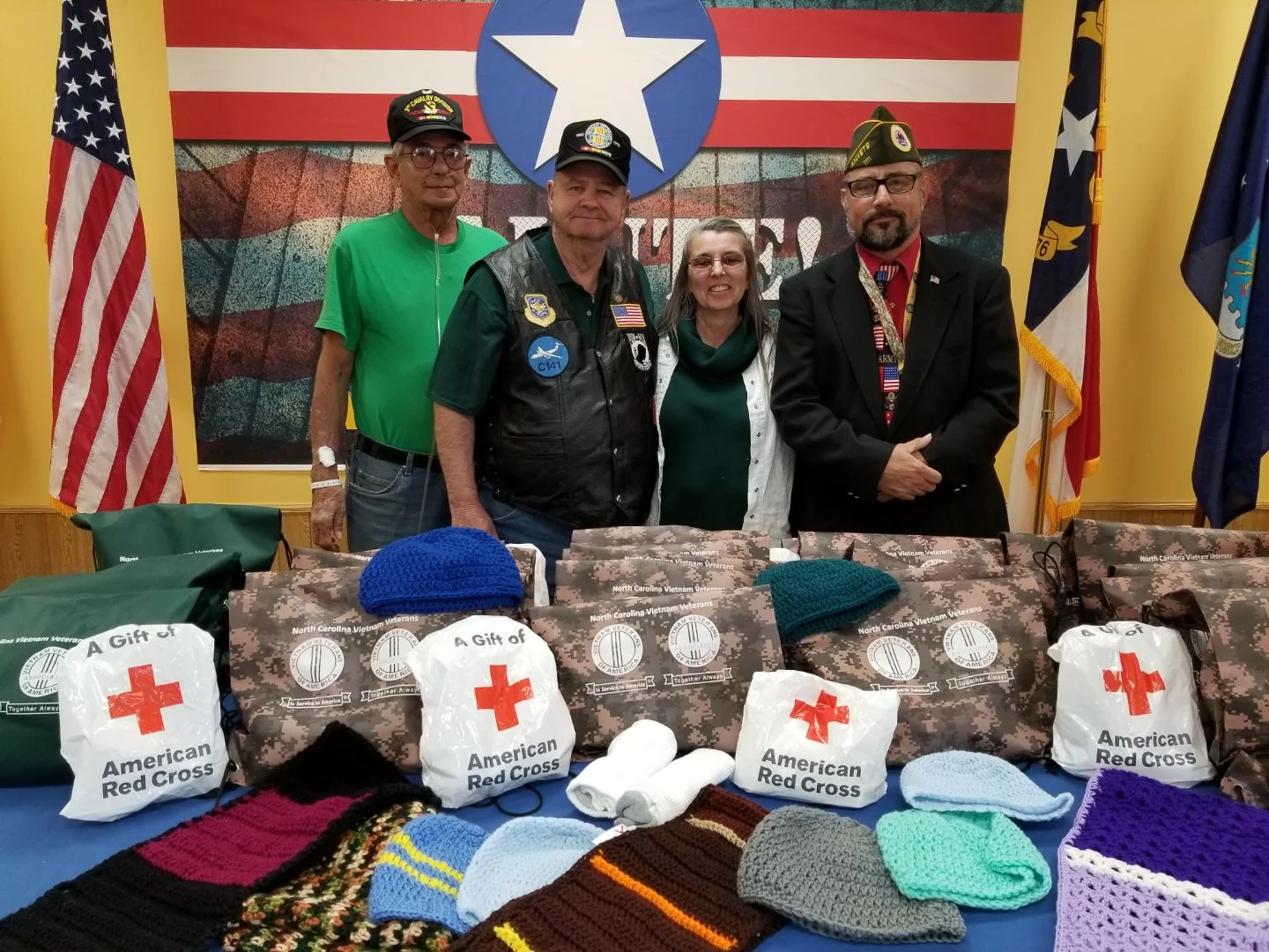 From left to right: Eric Cantu, Curator of G I Joes Museum/SALUTE, Wilson Jones, member of Vietnam Veterans Of America, Chapter #892, Debra Moore, American Red Cross, Services to the Armed Forces Manager of the American Red Cross, and Victor Kosinski, Point In Time Lead for Lenoir County/Commander AMVETS Post #1111. Bags of care items for the homeless were donated by the American Red Cross, Vietnam Veterans of America Chapter 892, and G I Joes Museum/SALUTE. Submitted Photo