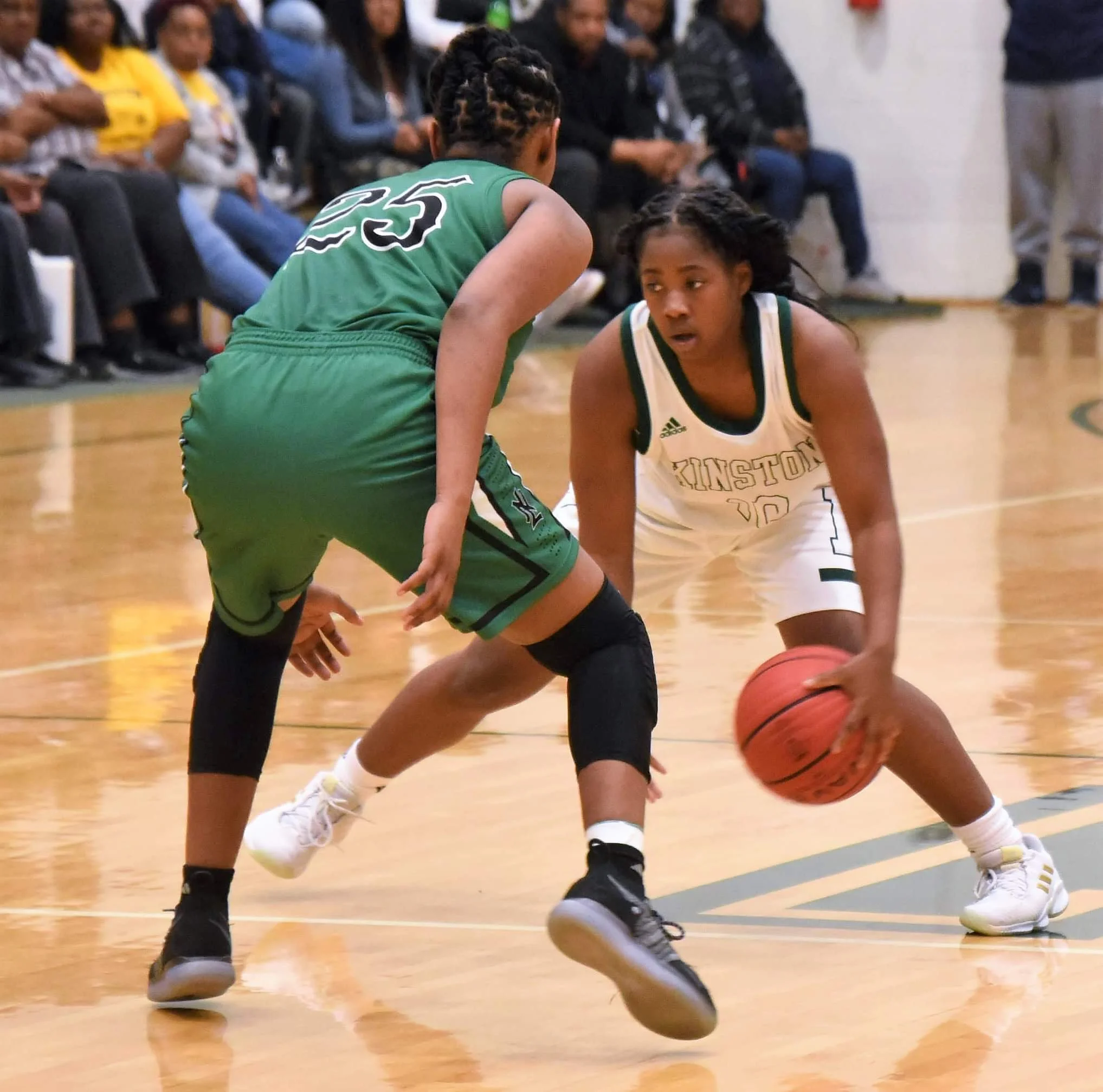Kinston's Samantha Lee looks to make a move against North Lenoir's Ashanti Lynch during Friday's game. Photo by William “Bud” Hardy / Neuse News