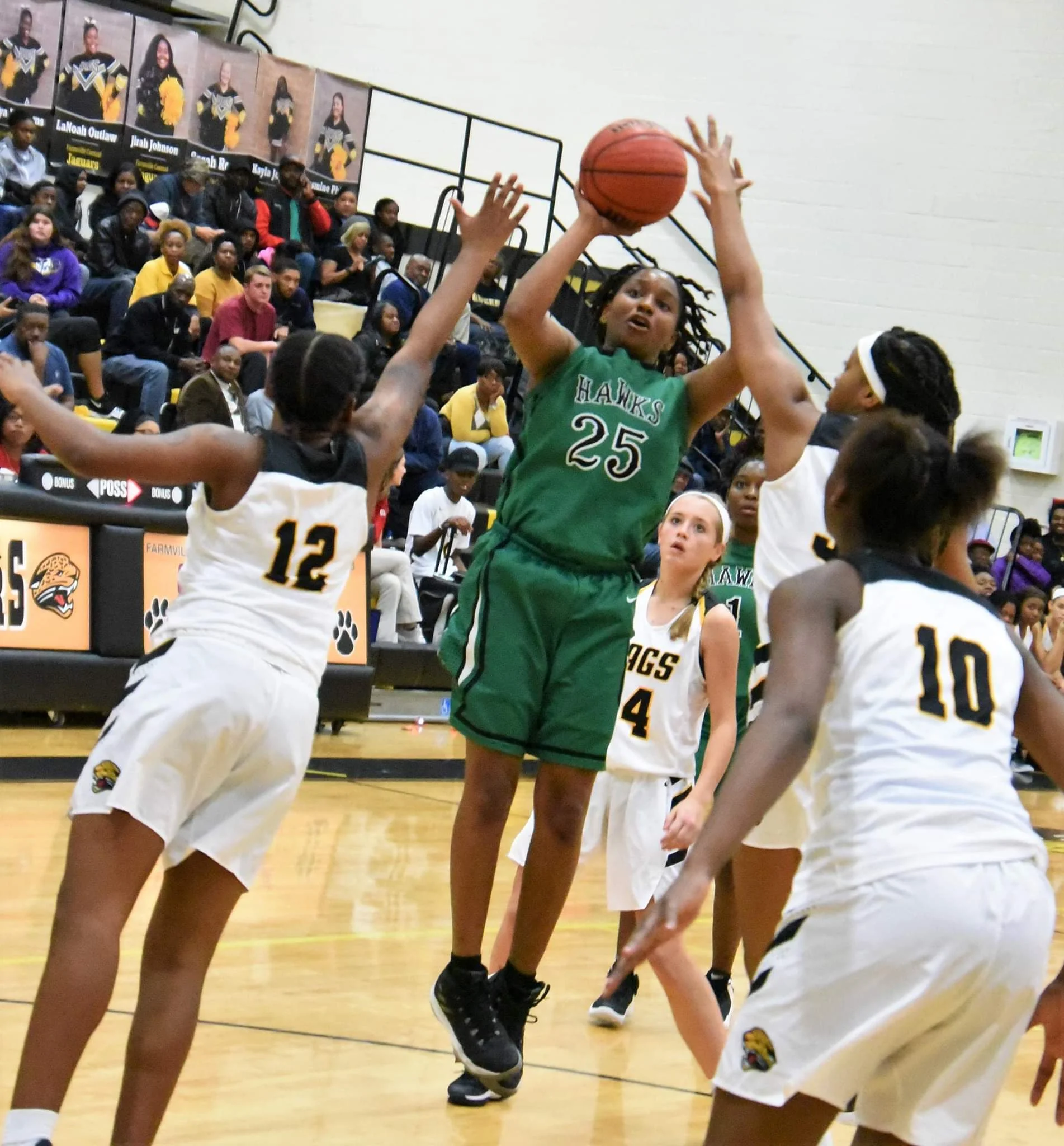 North Lenoir’s Ashanti Lynch shoots under heavy duress against Farmville Central on Dec. 5. The Hawks received a No. 13 seed in the state playoffs. Photo by William ‘Bud’ Hardy / Neuse News