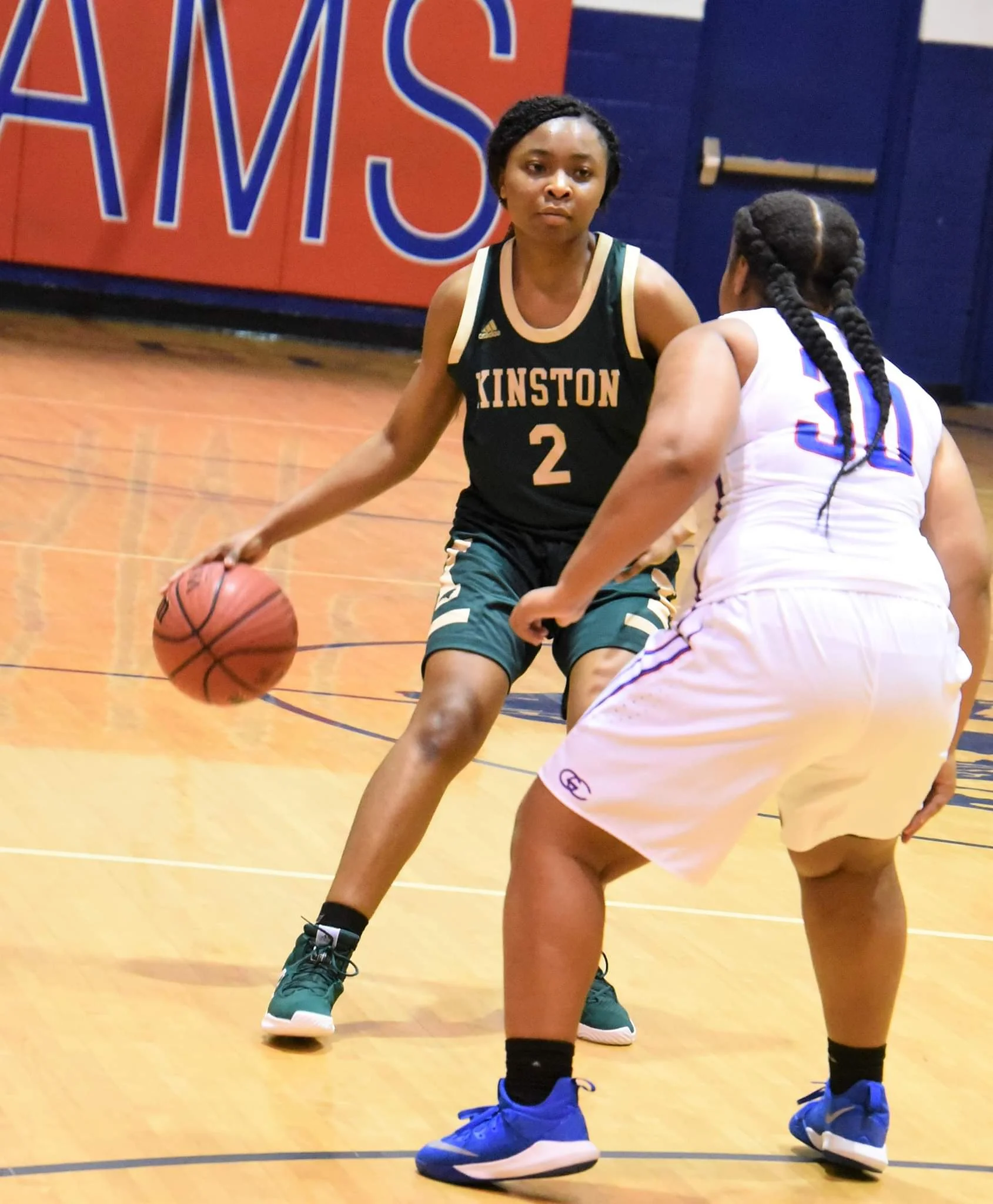 Kinston’s Khalia Hargett looks to make a play while being defended against Greene Central’s Leaudrea Mason during a game on Dec. 14, 2018. Photo by William “Bud” Hardy