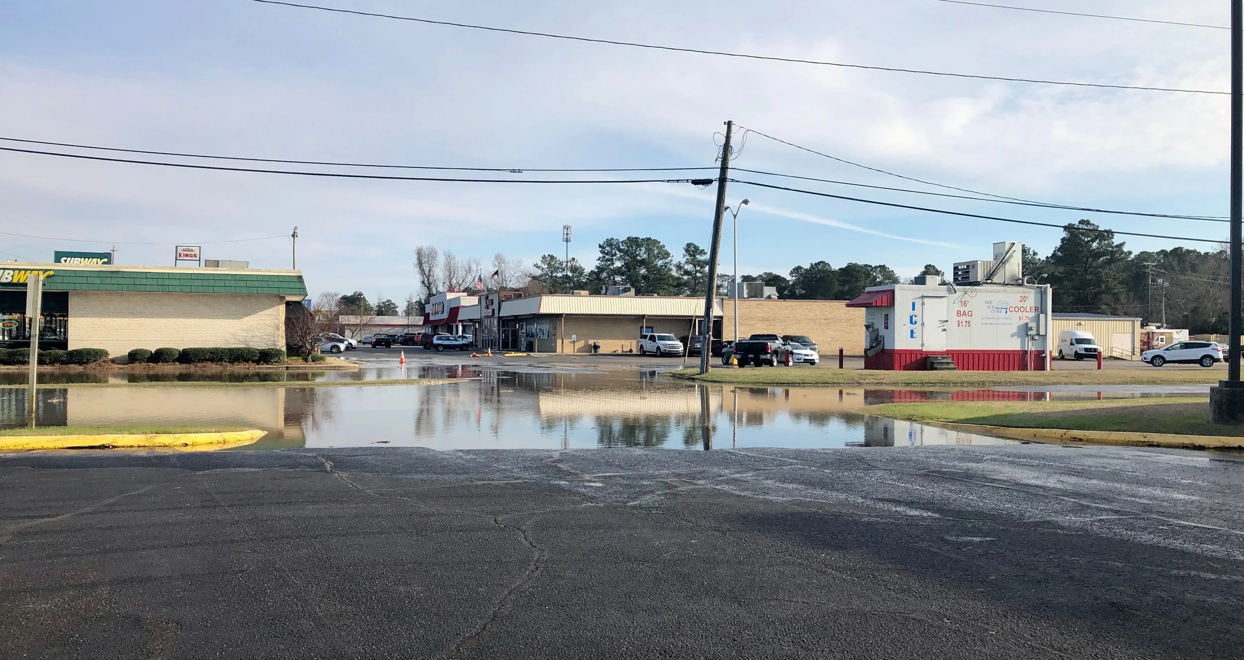 Meadowbrook Drive flooded with water from the destroyed hydrant. Photo by Catherine Hardee / Neuse News