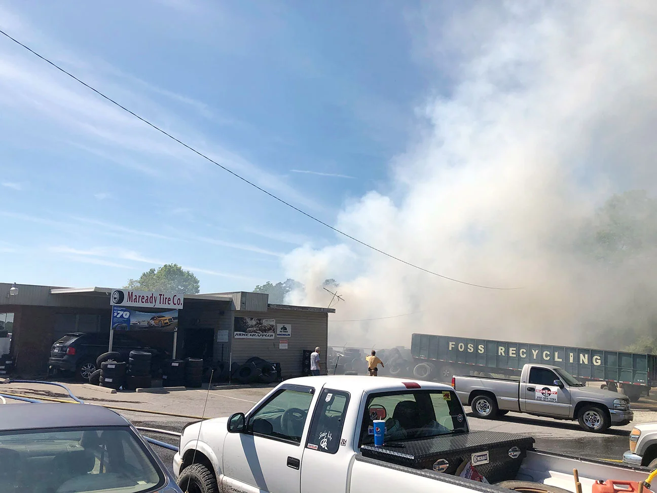 Firefighters battle the blaze at Maready Tire Company. Photo by Catherine Hardee / Neuse News
