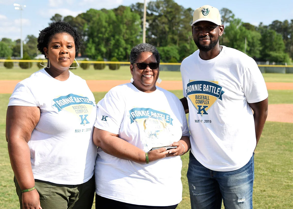 Members of Ronnie Battle’s immediate family — from left, Torise Battle Young (daughter), Birta Battle (wife) and Joel Battle (son) — pose for a photo following Saturday’s ceremony. Photo by William ‘Bud’ Hardy / Neuse News