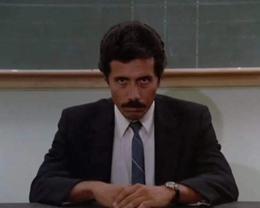 Edward James Olmos enjoys a lighthearted moment portraying Lt. Martin Castillo on Miami Vice / NBC