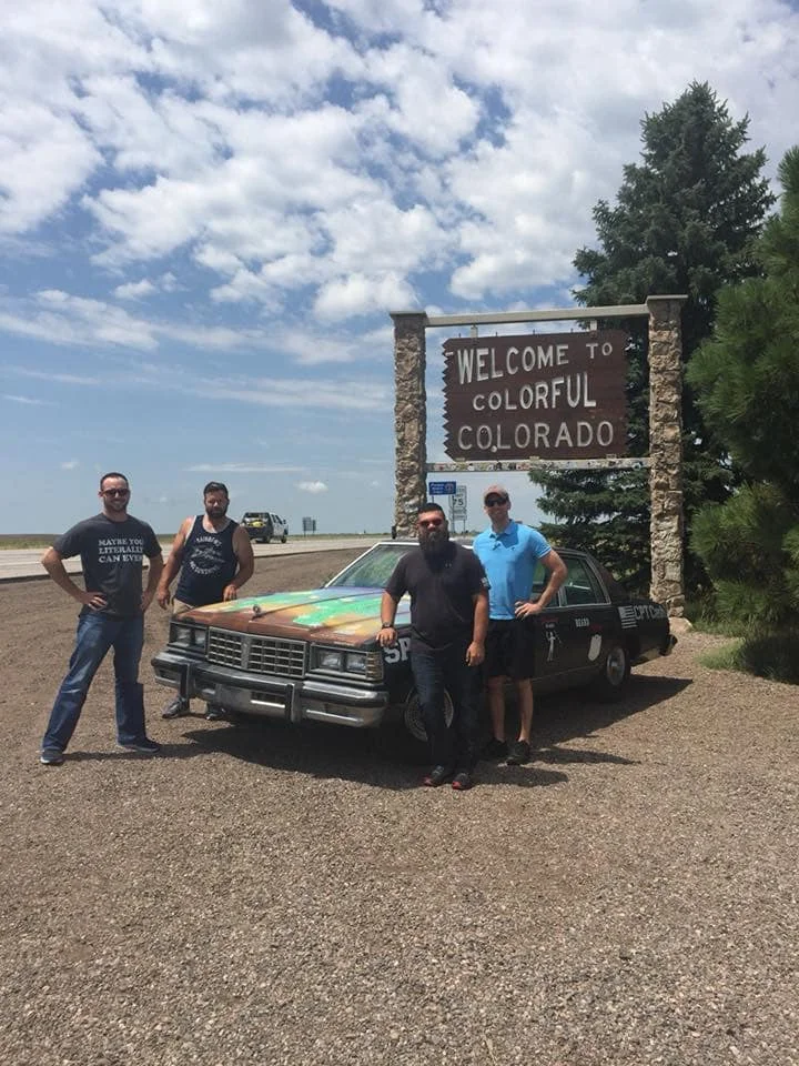 Danny Webb, Billy Nas, Jeremy Whitfield and Milton Foster pose with last year’s ‘Junker’ that made it all the way to California. Photo courtesy of Milton Foster