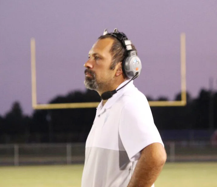 With a beautiful sky behind him, South Lenoir head football coach Jeremy Joyner led his Blue Devils to victory Friday night. Photo by Linda Whittington / Neuse News