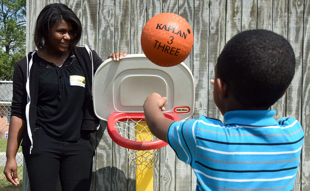 Ketia Moore, a junior at Kinston High, was undeterred in her plans to become a teacher after spending a morning with pre-kindergarten students at Southeast Elementary School. ‘They’re kids, they’re loud, but they are really enjoyable,’ she said.