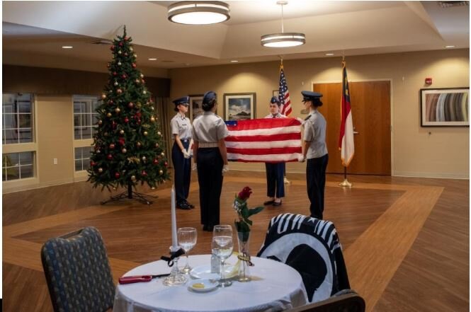 C/MSgt Alona Arnette, C/Amn Ysabella Bylica, C/Maj Maggie Thibodeaux, and C/Amn Aliciana Bylica perform a flag folding ceremony. Photo Credit: C/SrA Anna Cunningham