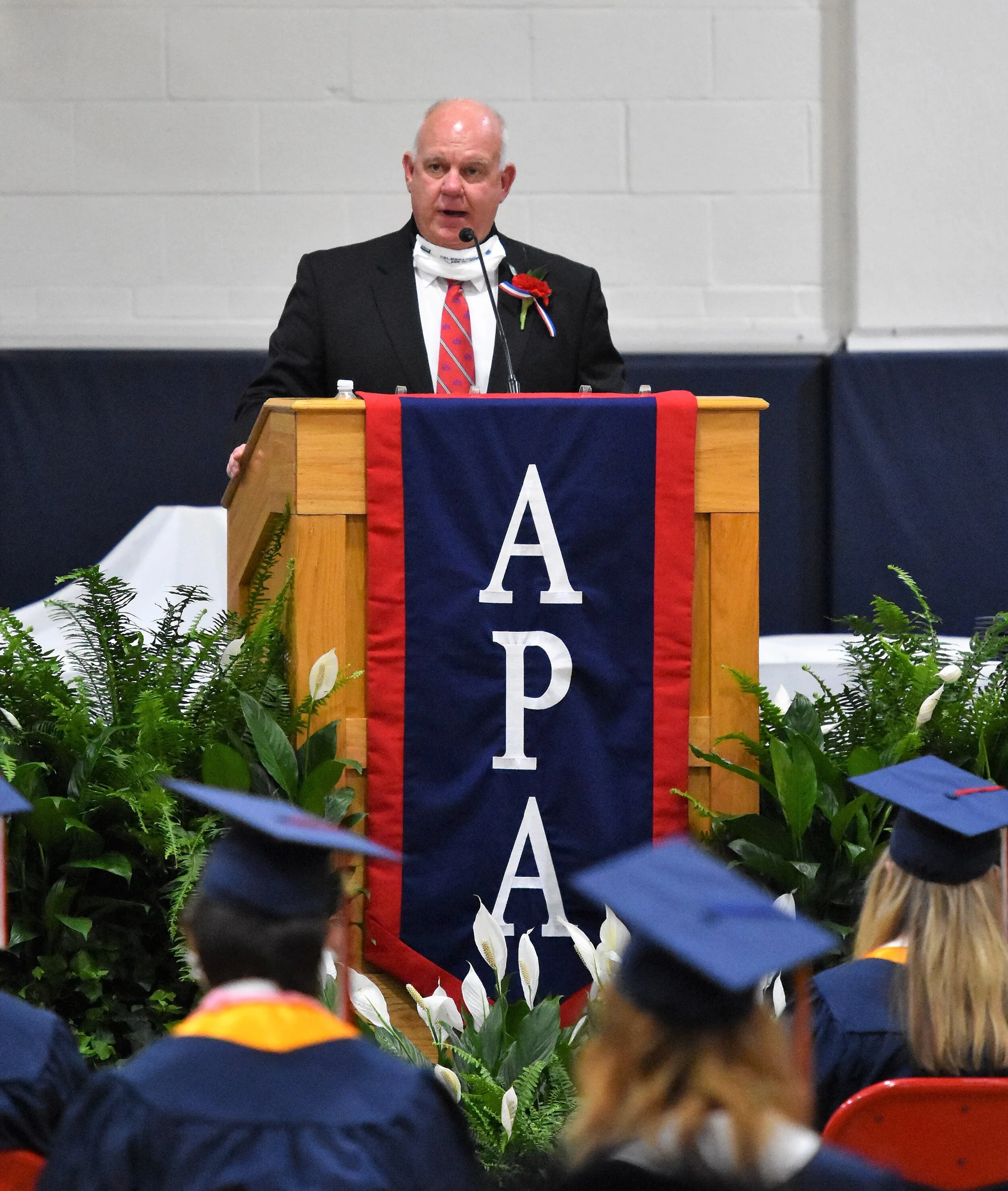Dr. Bert Bright, Parrott headmaster, delivers welcoming remarks during his last graduation before retirement