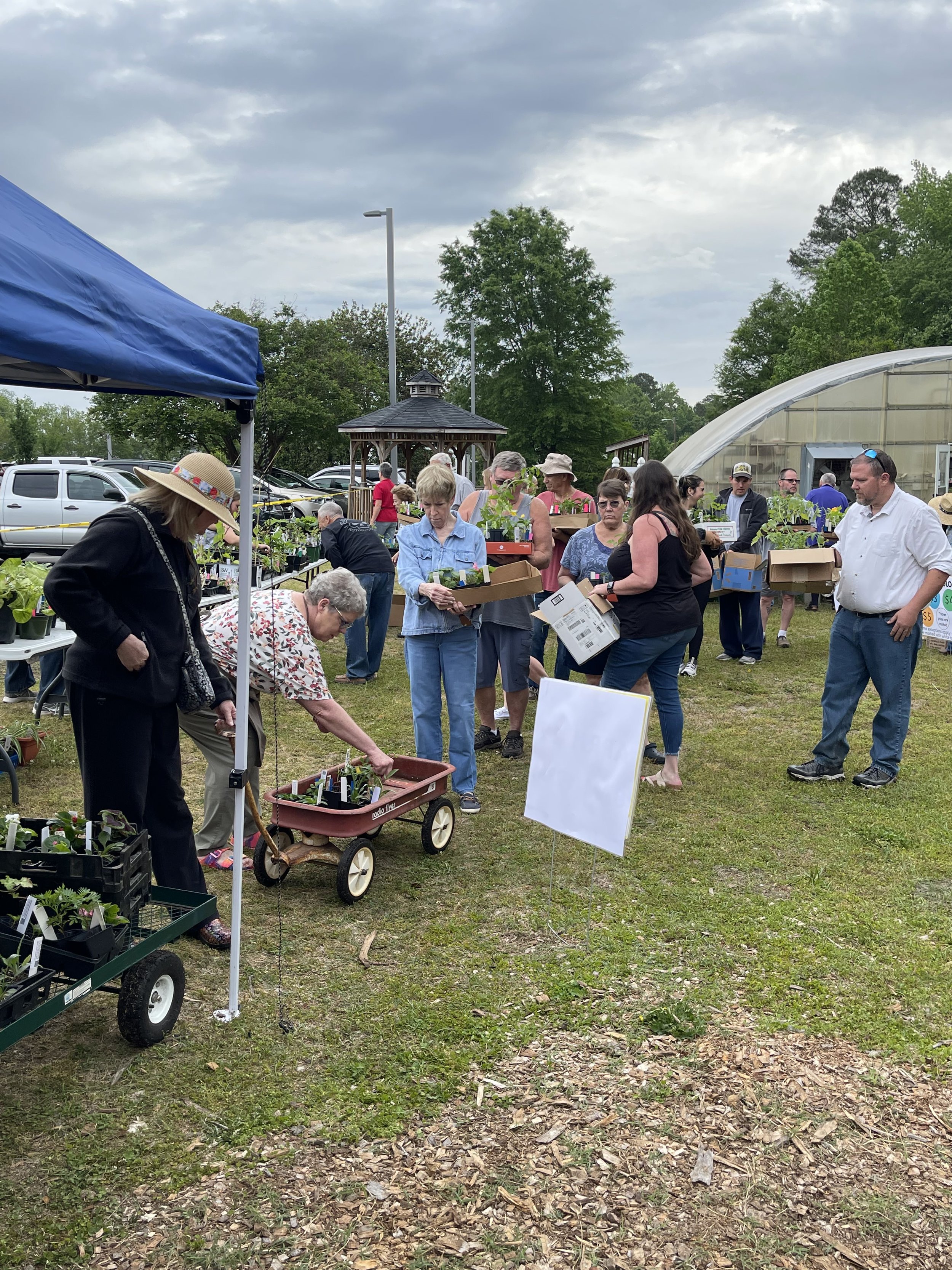 Shortly after "opening" the sale Saturday morning the checkout line was beginning to form! Many happy customers were ready to take home their purchases and get planting.