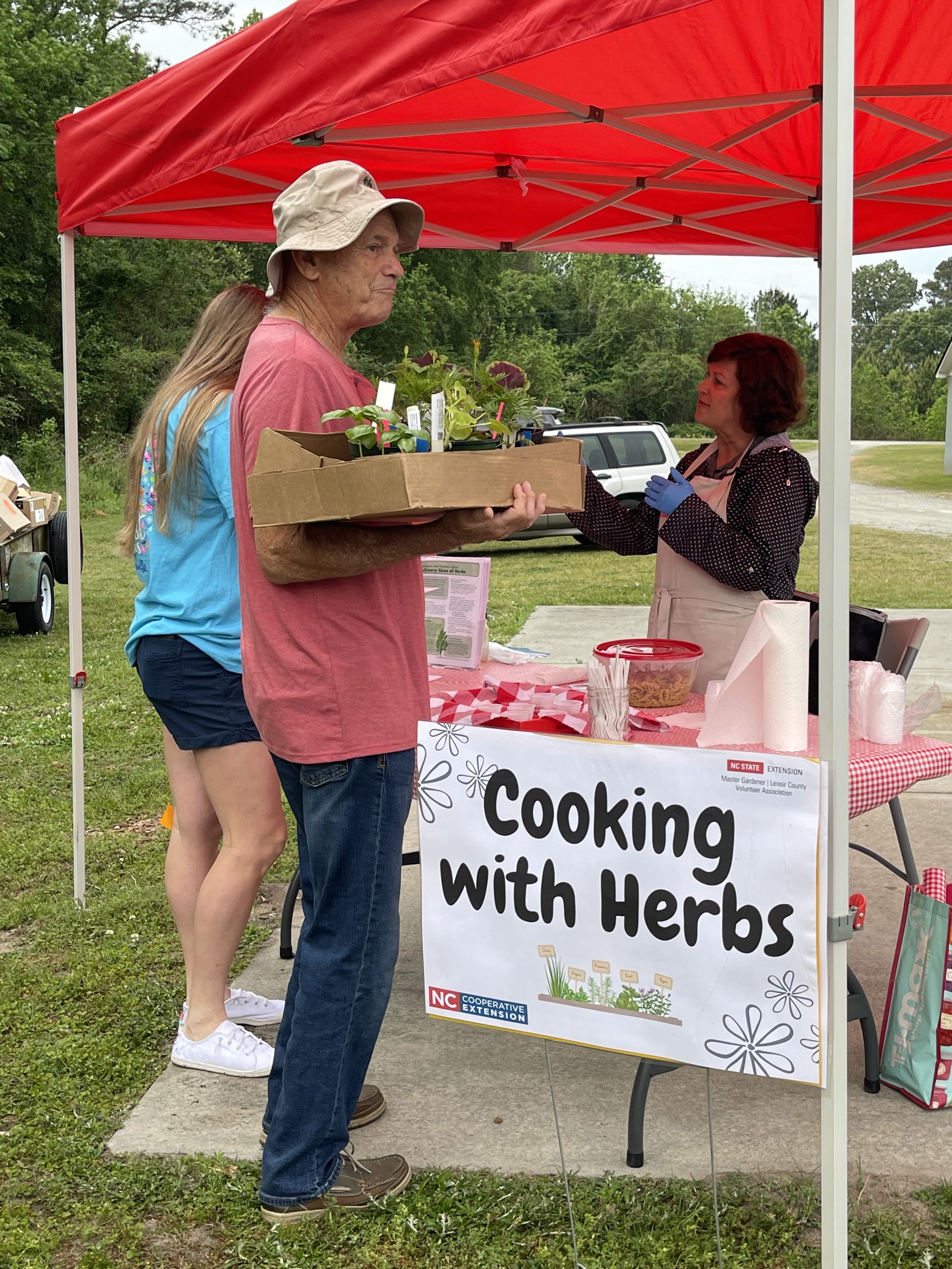 Family &amp; Consumer Science Agent Kelly Tyndall shared information with Plant Sale customers on uses of herbs they could purchase and make a part of their dishes.